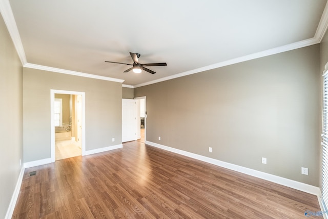 unfurnished bedroom with ensuite bathroom, light hardwood / wood-style floors, crown molding, and ceiling fan