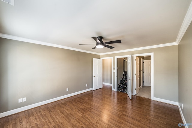 unfurnished bedroom featuring dark hardwood / wood-style flooring, ceiling fan, and ornamental molding