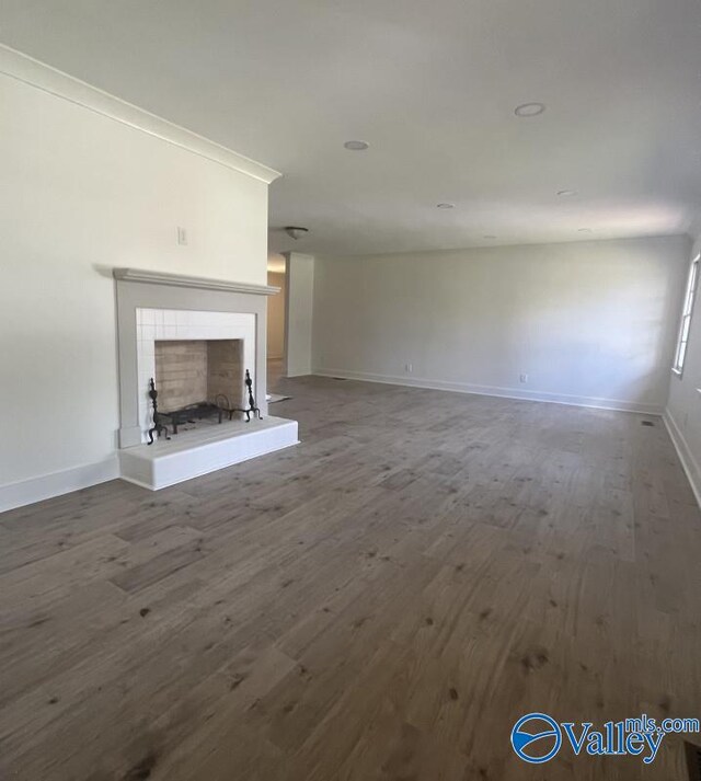 unfurnished living room with hardwood / wood-style flooring