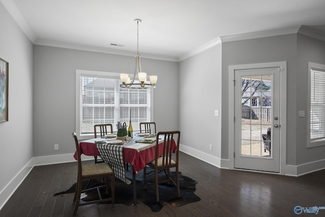 dining space with dark wood-type flooring, crown molding, baseboards, and visible vents