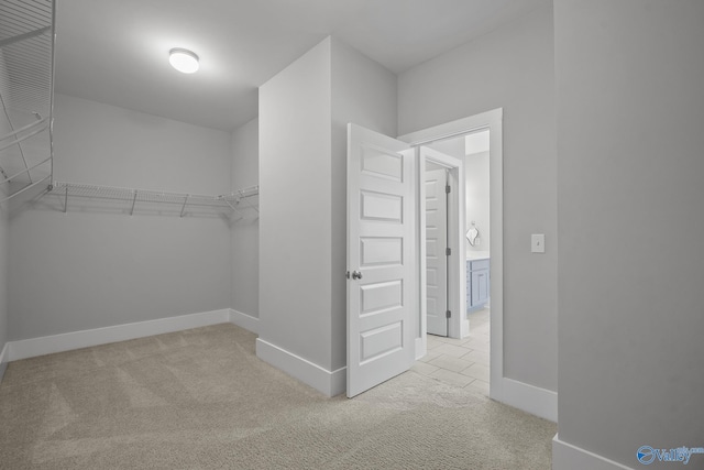 walk in closet featuring carpet