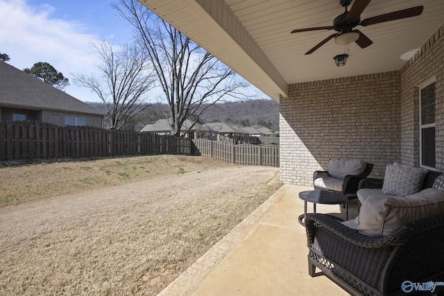 view of patio / terrace with a fenced backyard and a ceiling fan