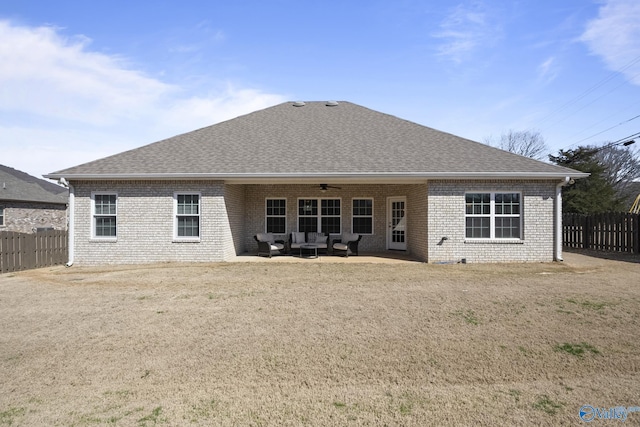 rear view of house with an outdoor hangout area, a shingled roof, a ceiling fan, and fence