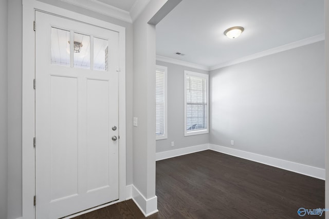 entryway with visible vents, baseboards, dark wood-style flooring, and ornamental molding