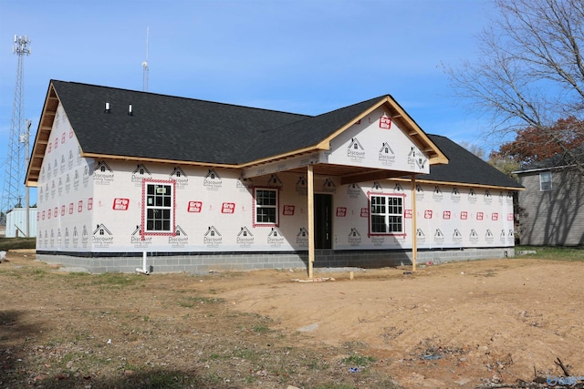 property under construction featuring roof with shingles