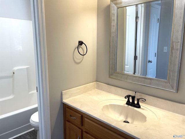 bathroom featuring toilet and vanity