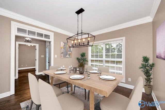 22656 Riviera Dr, Athens, AL 35613 - dining area featuring a chandelier, dark wood-style flooring, crown molding, and baseboards