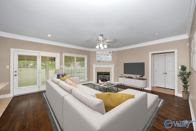 22656 Riviera Dr, Athens, AL 35613 - living room with a ceiling fan, a tile fireplace, ornamental molding, wood finished floors, and baseboards