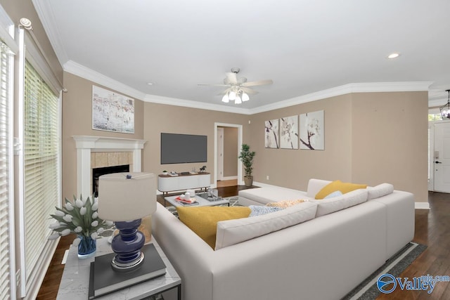 22656 Riviera Dr, Athens, AL 35613 - living area featuring a tile fireplace, crown molding, dark wood-style floors, recessed lighting, and a ceiling fan