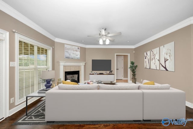 22656 Riviera Dr, Athens, AL 35613 - living room with a tile fireplace, wood finished floors, a ceiling fan, baseboards, and crown molding