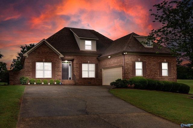 22656 Riviera Dr, Athens, AL 35613 - traditional home featuring a yard, concrete driveway, brick siding, a shingled roof, and an attached garage