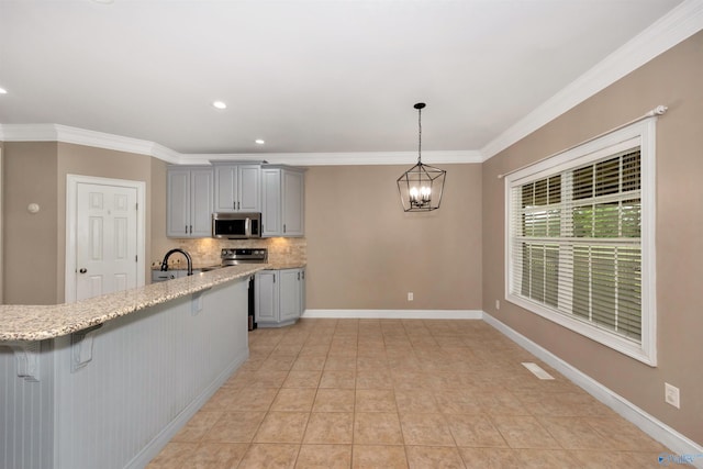 22656 Riviera Dr, Athens, AL 35613 - kitchen featuring stainless steel microwave, gray cabinetry, a sink, tasteful backsplash, and ornamental molding