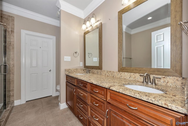 22656 Riviera Dr, Athens, AL 35613 - bathroom with double vanity, a stall shower, toilet, ornamental molding, and tile patterned flooring