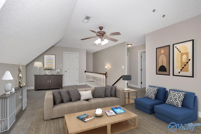 22656 Riviera Dr, Athens, AL 35613 - carpeted living room featuring a ceiling fan, baseboards, a textured ceiling, and lofted ceiling