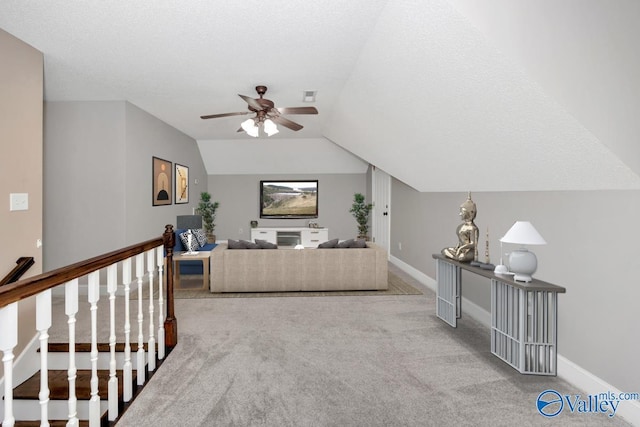 22656 Riviera Dr, Athens, AL 35613 - carpeted living area with a ceiling fan, lofted ceiling, and baseboards