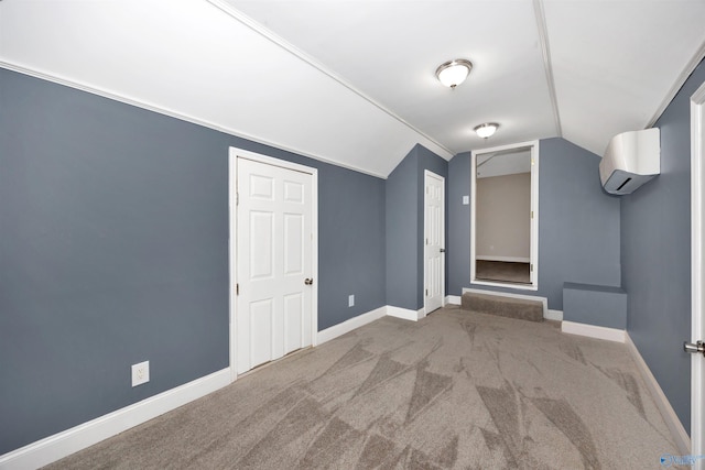 22656 Riviera Dr, Athens, AL 35613 - bonus room featuring an AC wall unit, lofted ceiling, carpet flooring, and baseboards