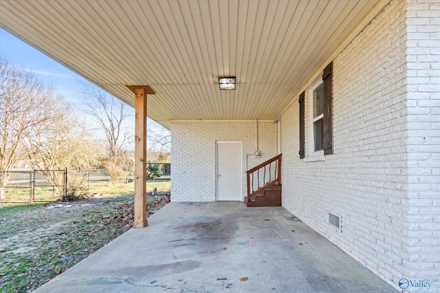 view of patio with entry steps and fence