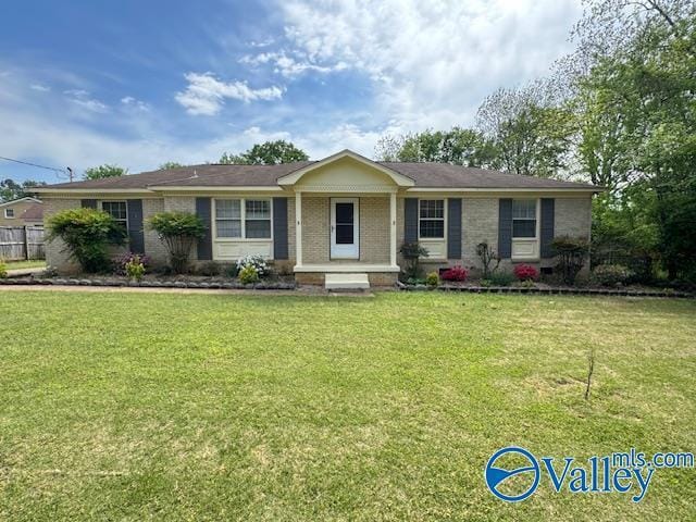 416 Curtis Dr SE, Huntsville, AL 35803 - ranch-style home featuring fence, a front lawn, and brick siding