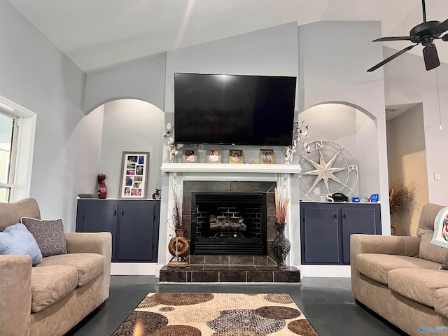 living room with ceiling fan, a fireplace, and high vaulted ceiling