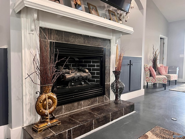 details featuring a fireplace and concrete floors