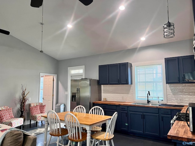 interior space featuring sink and vaulted ceiling