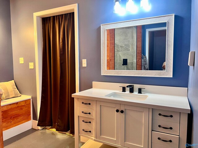 bathroom with vanity and concrete flooring