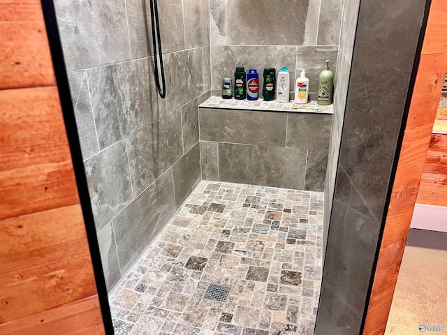 bathroom with tiled shower