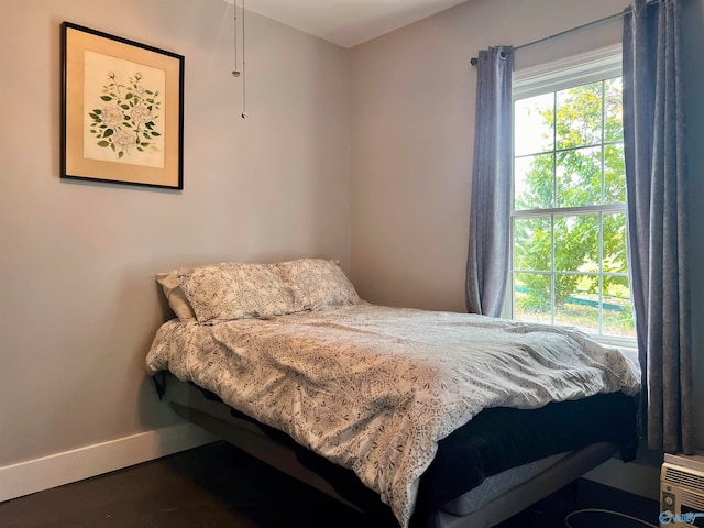 bedroom featuring hardwood / wood-style floors