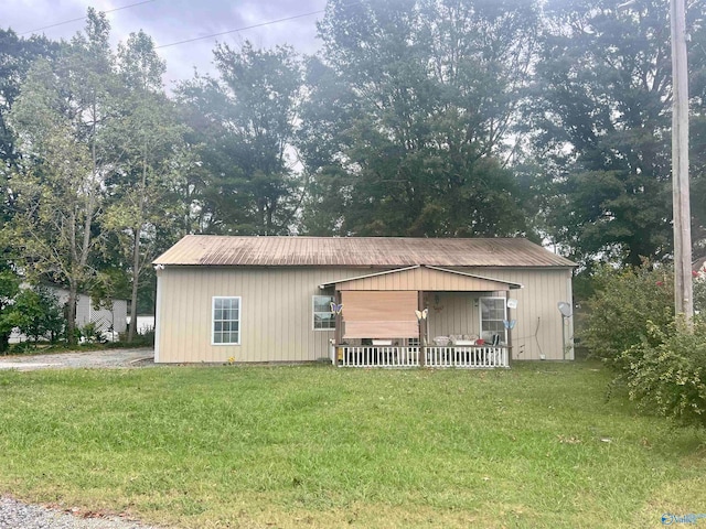 view of outbuilding featuring a yard