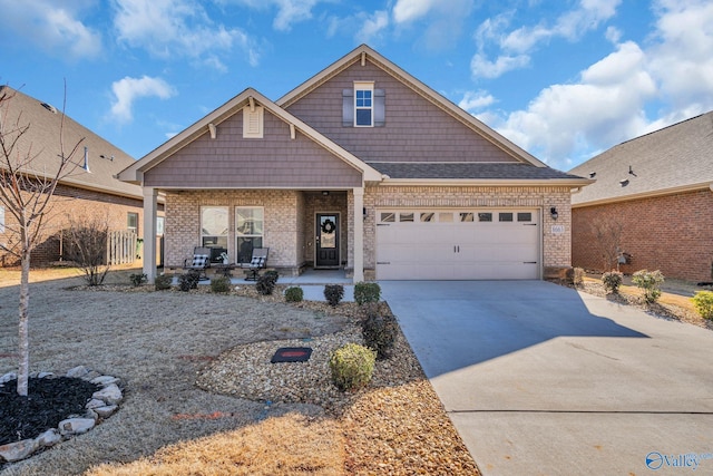 view of front of house featuring a garage and a porch