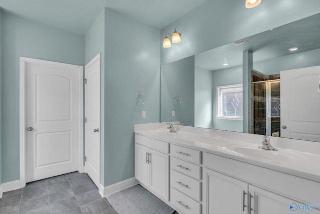 bathroom featuring vanity, tile patterned floors, and walk in shower