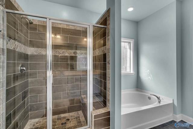 bathroom with shower with separate bathtub