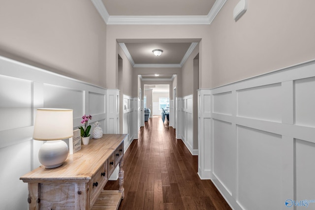 hall featuring dark wood-type flooring and ornamental molding