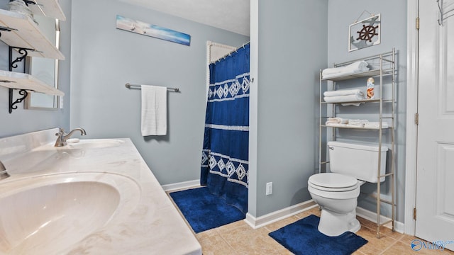 full bath featuring baseboards, a sink, toilet, and tile patterned floors