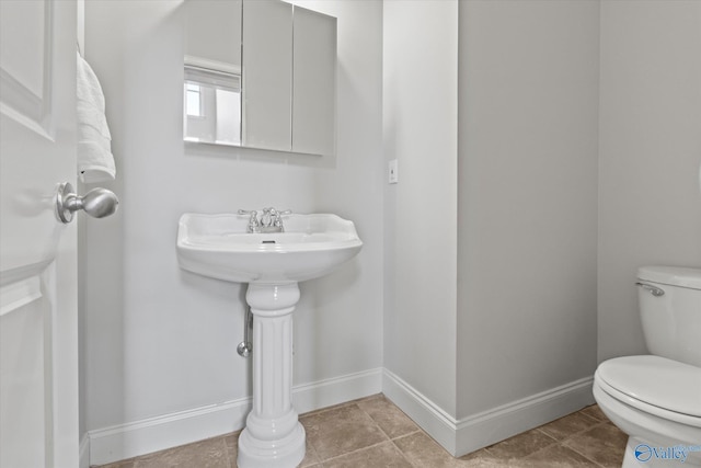 bathroom featuring tile patterned floors and toilet