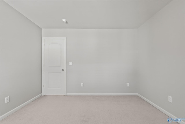 empty room with light colored carpet