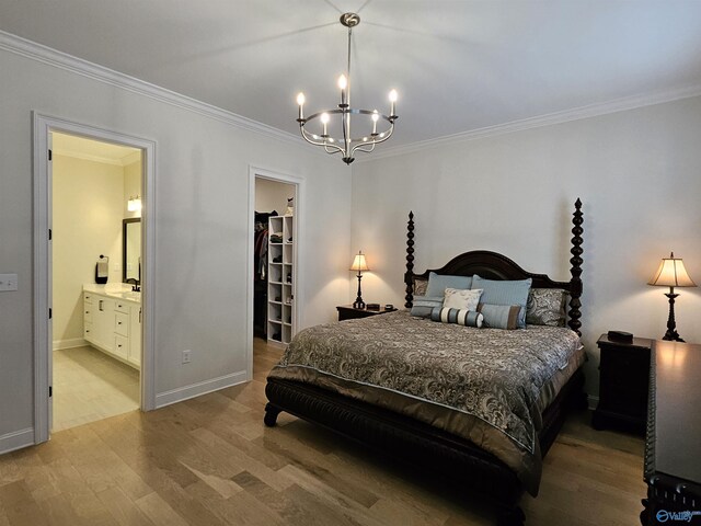 bedroom with crown molding, a chandelier, and hardwood / wood-style flooring