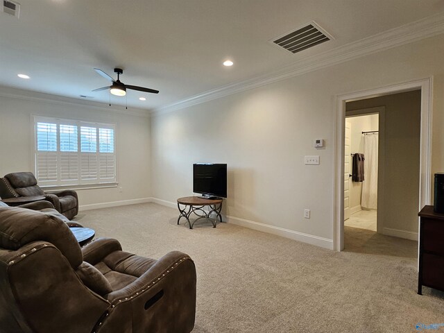 living room featuring ceiling fan, carpet floors, and ornamental molding