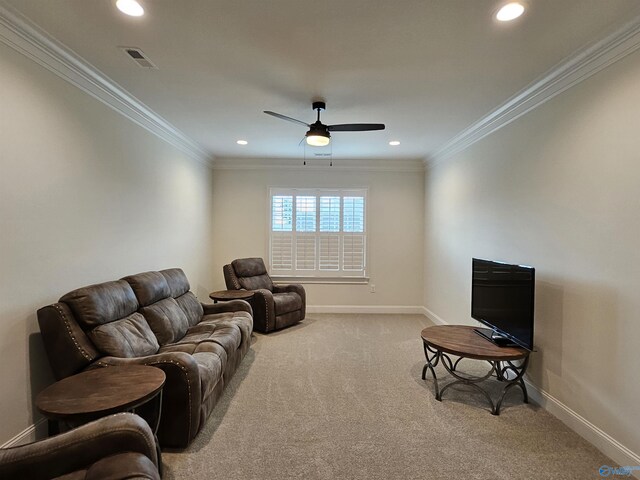 living room featuring ornamental molding, ceiling fan, and carpet floors