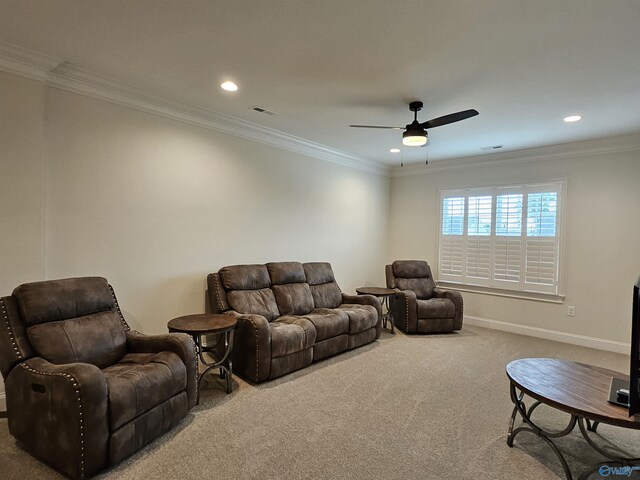 carpeted bedroom with ornamental molding and ceiling fan