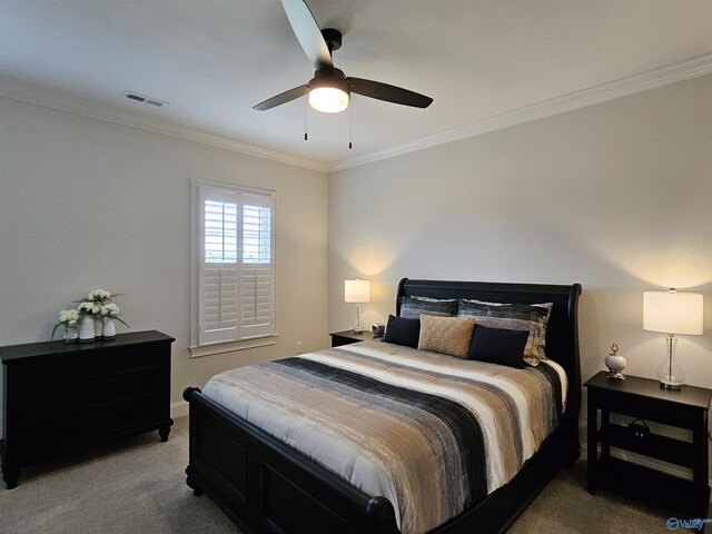 carpeted bedroom featuring ceiling fan, ornamental molding, and ensuite bathroom