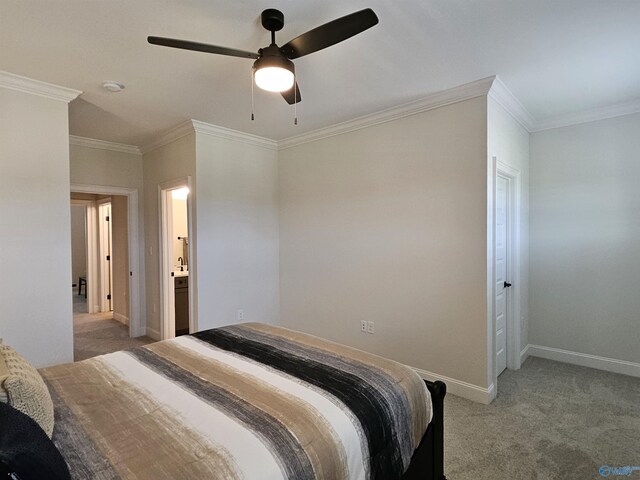 bathroom featuring toilet, crown molding, and vanity