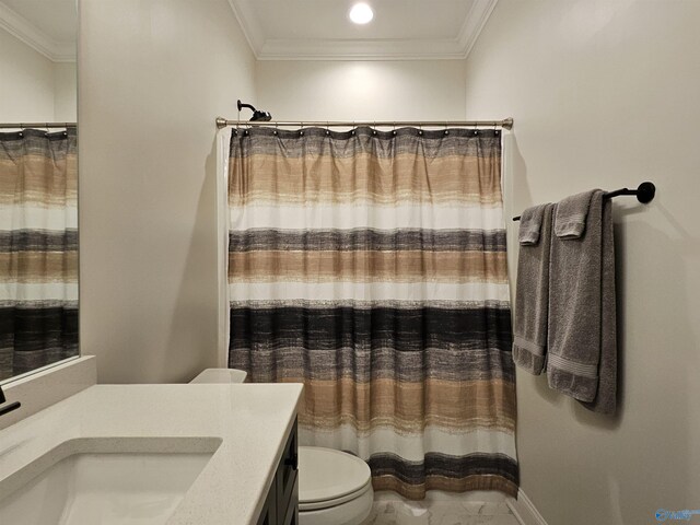 bathroom with toilet, ornamental molding, and vanity