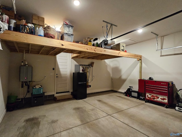 garage with water heater and a garage door opener