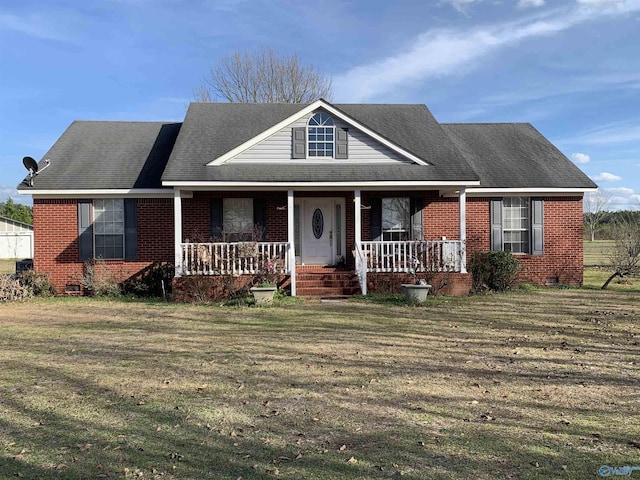 view of front of house with brick siding, a porch, and a front lawn