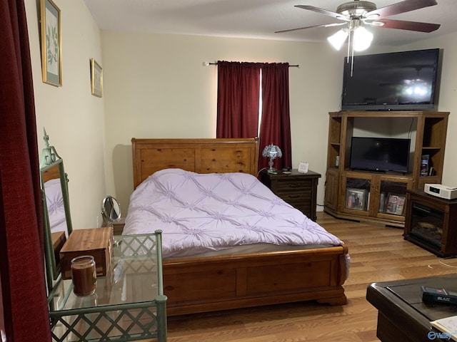 bedroom with wood finished floors and ceiling fan