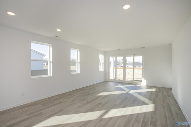 unfurnished room featuring light wood-type flooring