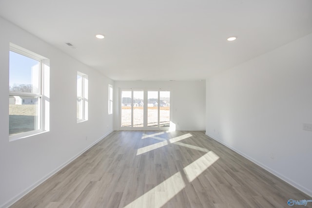 spare room with light hardwood / wood-style flooring