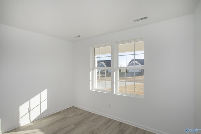 empty room with light wood-type flooring