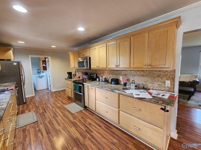 kitchen with ornamental molding, dark wood-style flooring, appliances with stainless steel finishes, and backsplash